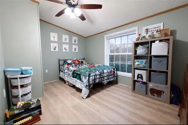 a bedroom with furniture and a book shelf