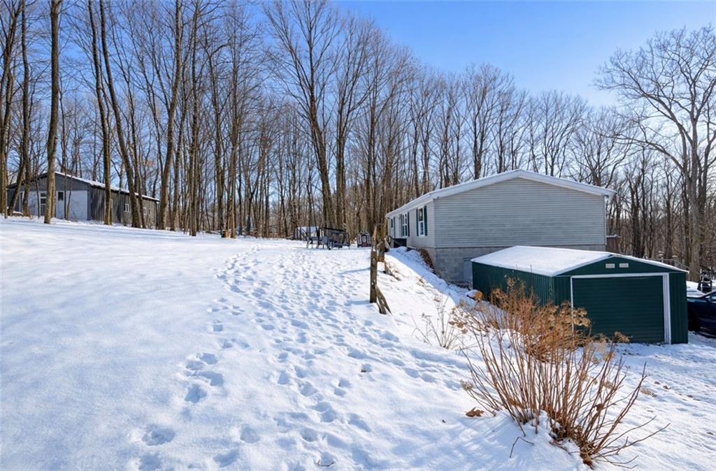 180 Hemlock Road Petrolia, PA 16050 - Photo 2 of 25 a backyard of a house with table and chairs