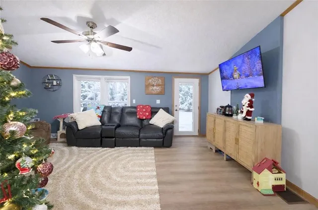 a living room with furniture and flowers