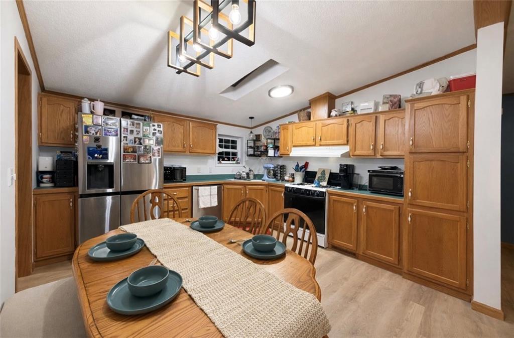 180 Hemlock Road Petrolia, PA 16050 - Photo 6 of 25 a kitchen with stainless steel appliances granite countertop a refrigerator a sink a stove and a refrigerator