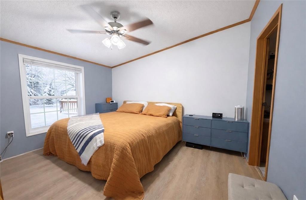 180 Hemlock Road Petrolia, PA 16050 - Photo 8 of 25 a bed room with a bed and a chandelier