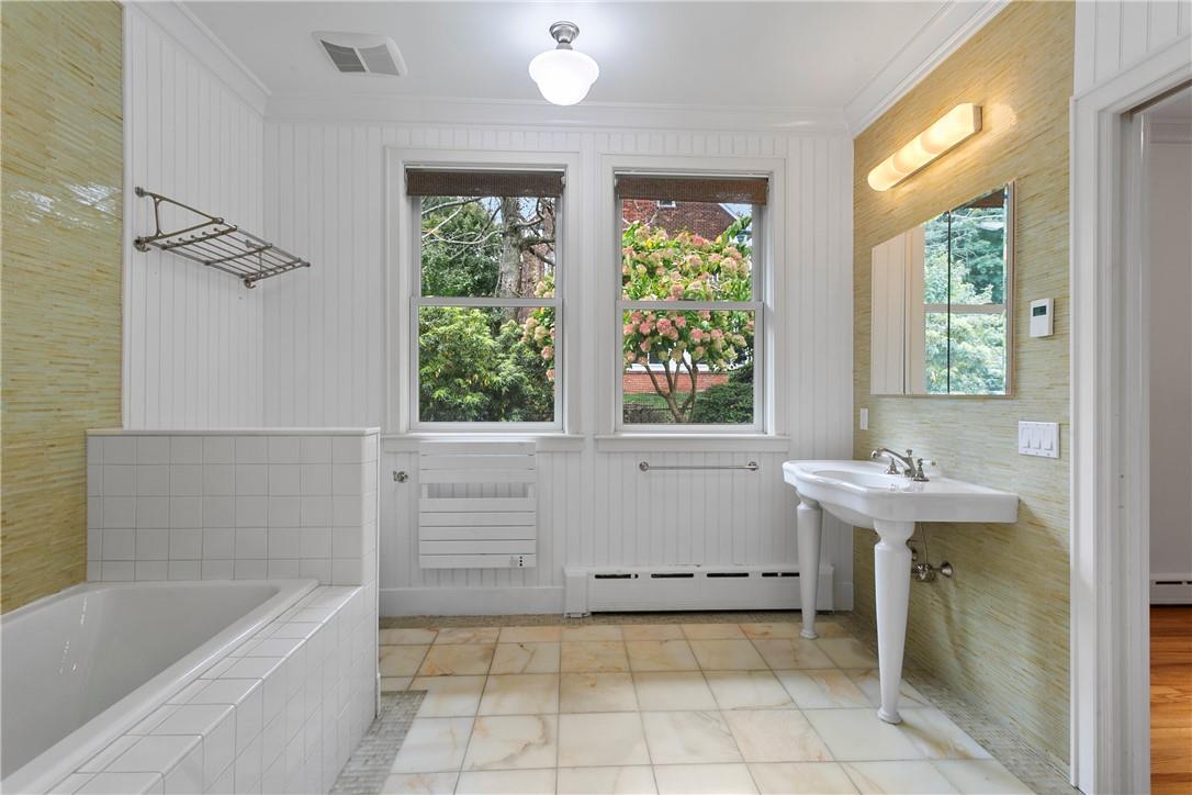 177 Clinton Avenue Dobbs Ferry, NY 10522 - Photo 11 of 29 a bathroom with a sink a bathtub and window