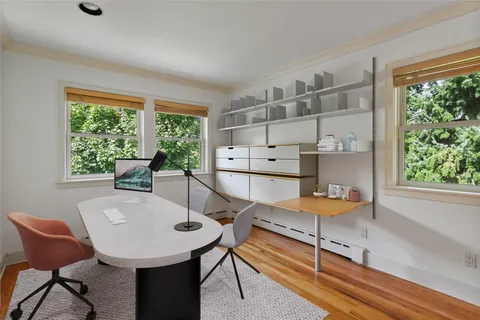 a view of a dining room with furniture window and outside view