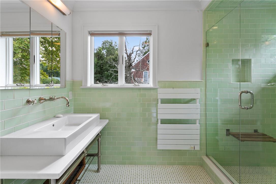177 Clinton Avenue Dobbs Ferry, NY 10522 - Photo 21 of 29 a bathroom with a sink a toilet and shower