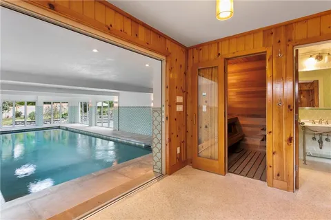 a view of swimming pool with outdoor seating