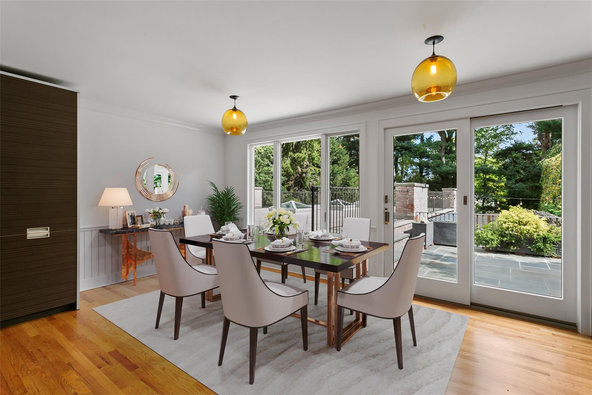 177 Clinton Avenue Dobbs Ferry, NY 10522 - Photo 6 of 29 a dining room with wooden floor and a floor to ceiling window