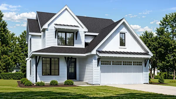 a view of a house with a yard and garage
