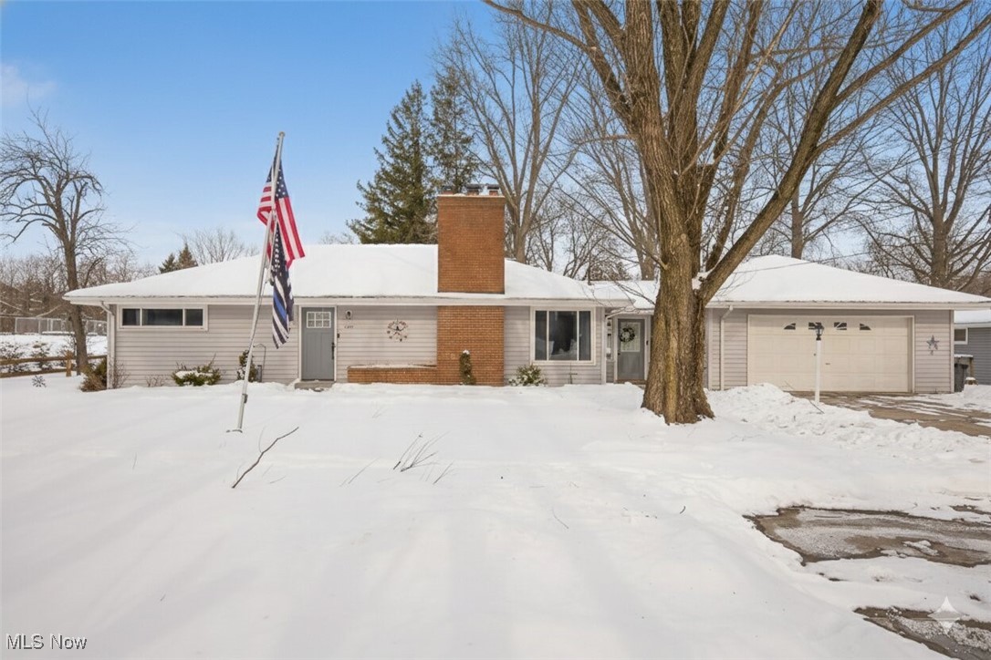 15446 Drake Road Strongsville, OH 44136 - Photo 3 of 42 View of front facade with a chimney and a garage