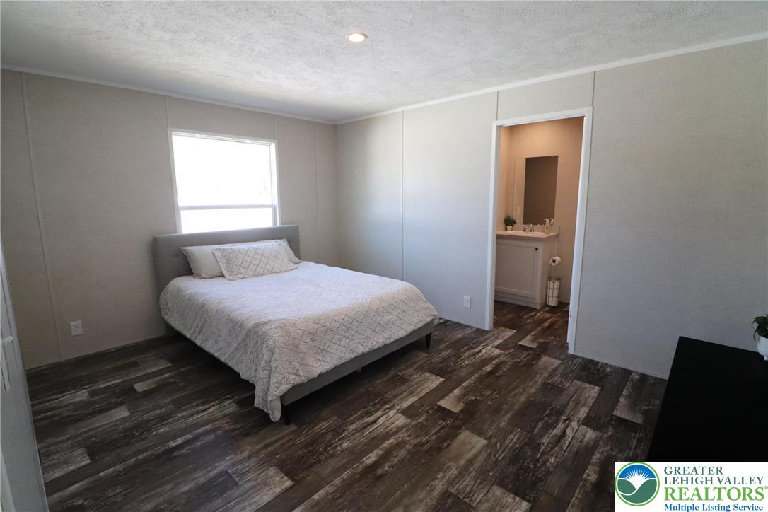 5016 Old Timber Road Stroudsburg, PA 18360 - Photo 13 of 34 a bedroom with a bed and window