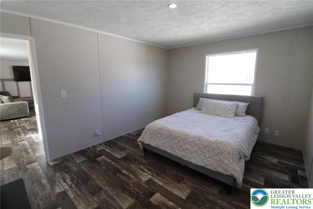 5016 Old Timber Road Stroudsburg, PA 18360 - Photo 14 of 34 a bedroom with a bed and a window