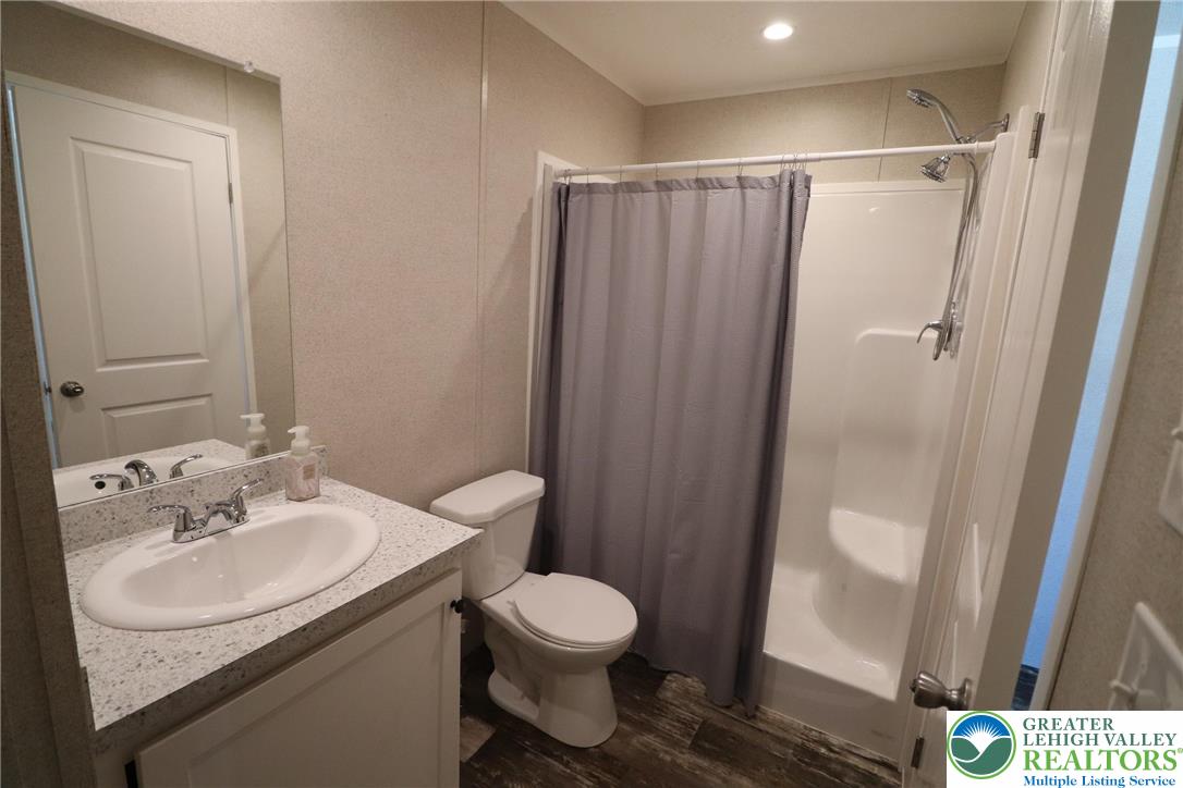 5016 Old Timber Road Stroudsburg, PA 18360 - Photo 17 of 34 a bathroom with a sink toilet and shower