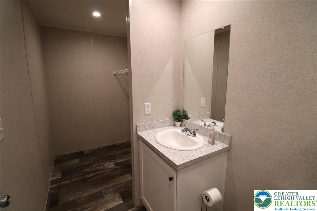 5016 Old Timber Road Stroudsburg, PA 18360 - Photo 19 of 34 a bathroom with a sink and a mirror