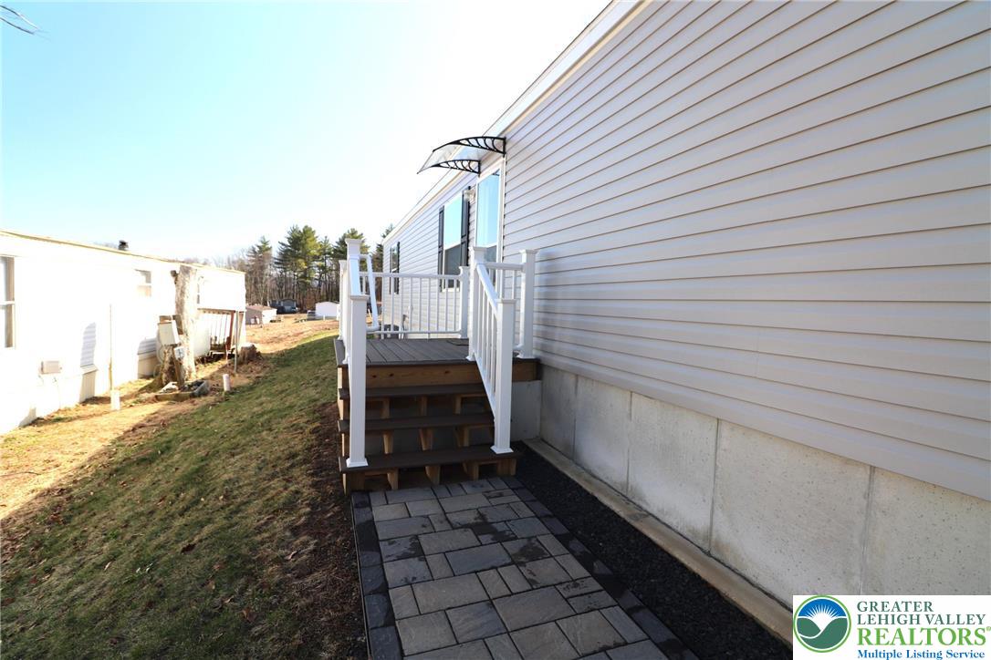 5016 Old Timber Road Stroudsburg, PA 18360 - Photo 2 of 34 a view of a porch with a bench