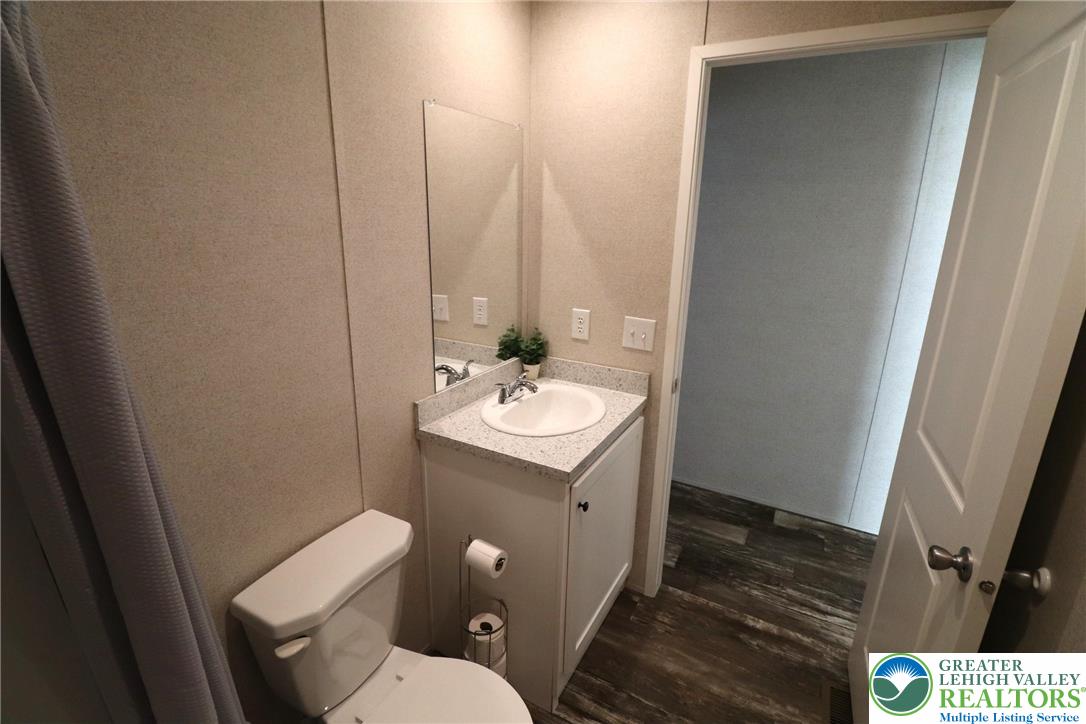 5016 Old Timber Road Stroudsburg, PA 18360 - Photo 23 of 34 a bathroom with a sink toilet and vanity