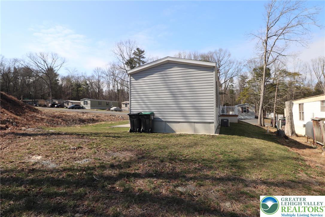 5016 Old Timber Road Stroudsburg, PA 18360 - Photo 30 of 34 a view of a house with a yard