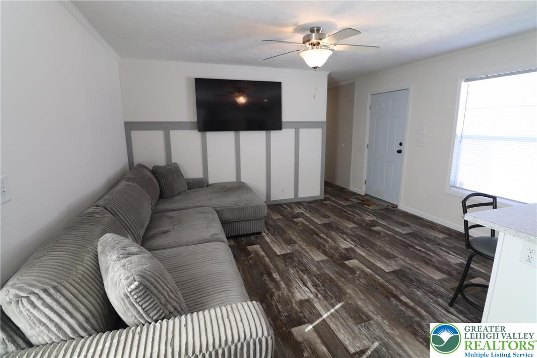 5016 Old Timber Road Stroudsburg, PA 18360 - Photo 3 of 34 a bedroom with a bed and a ceiling fan