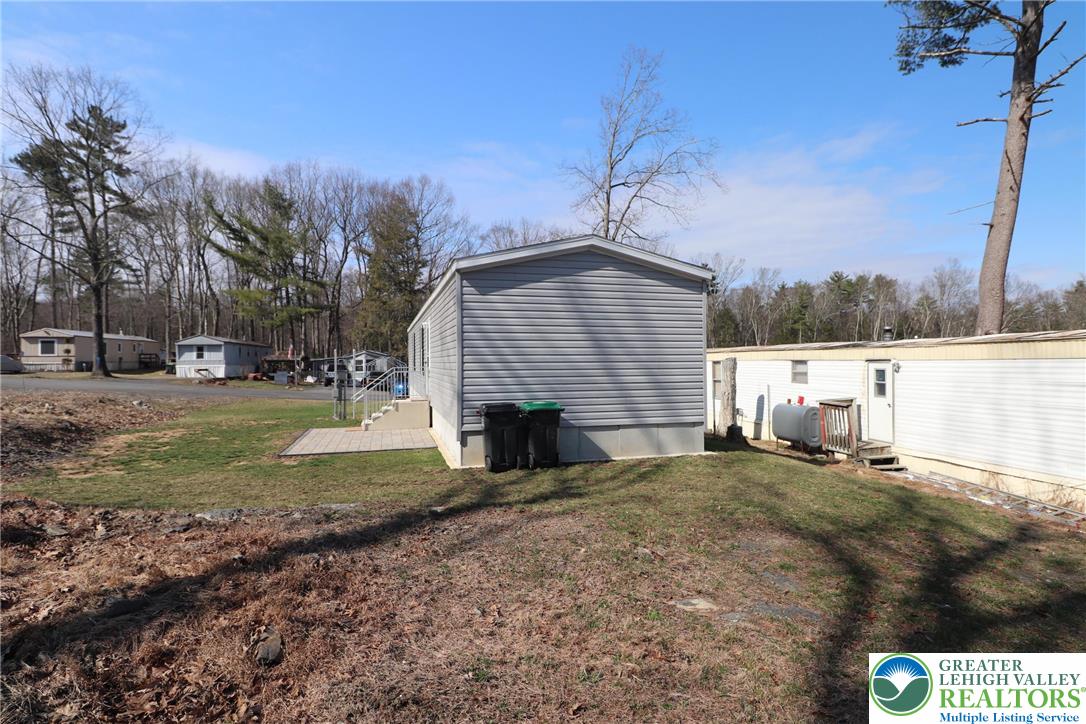 5016 Old Timber Road Stroudsburg, PA 18360 - Photo 31 of 34 a view of a house with a yard