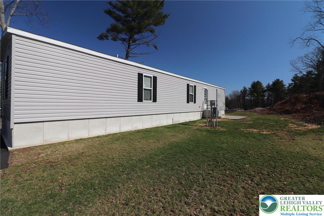 5016 Old Timber Road Stroudsburg, PA 18360 - Photo 32 of 34 a view of a backyard with plants and a garden