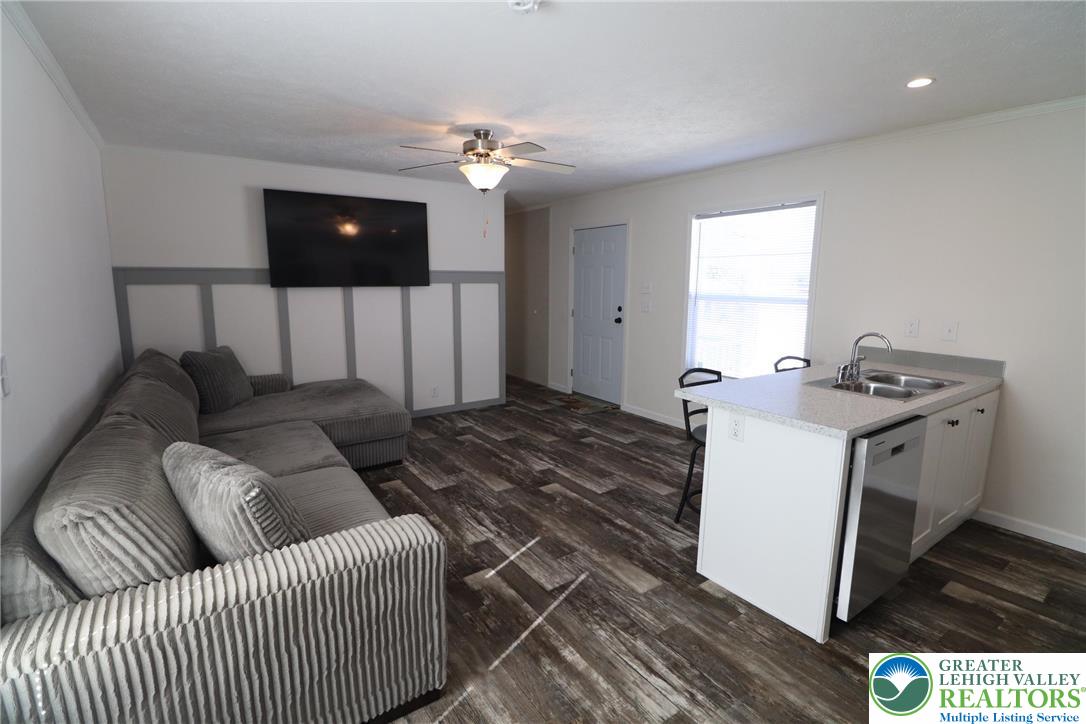 5016 Old Timber Road Stroudsburg, PA 18360 - Photo 4 of 34 a living room with furniture and a flat screen tv