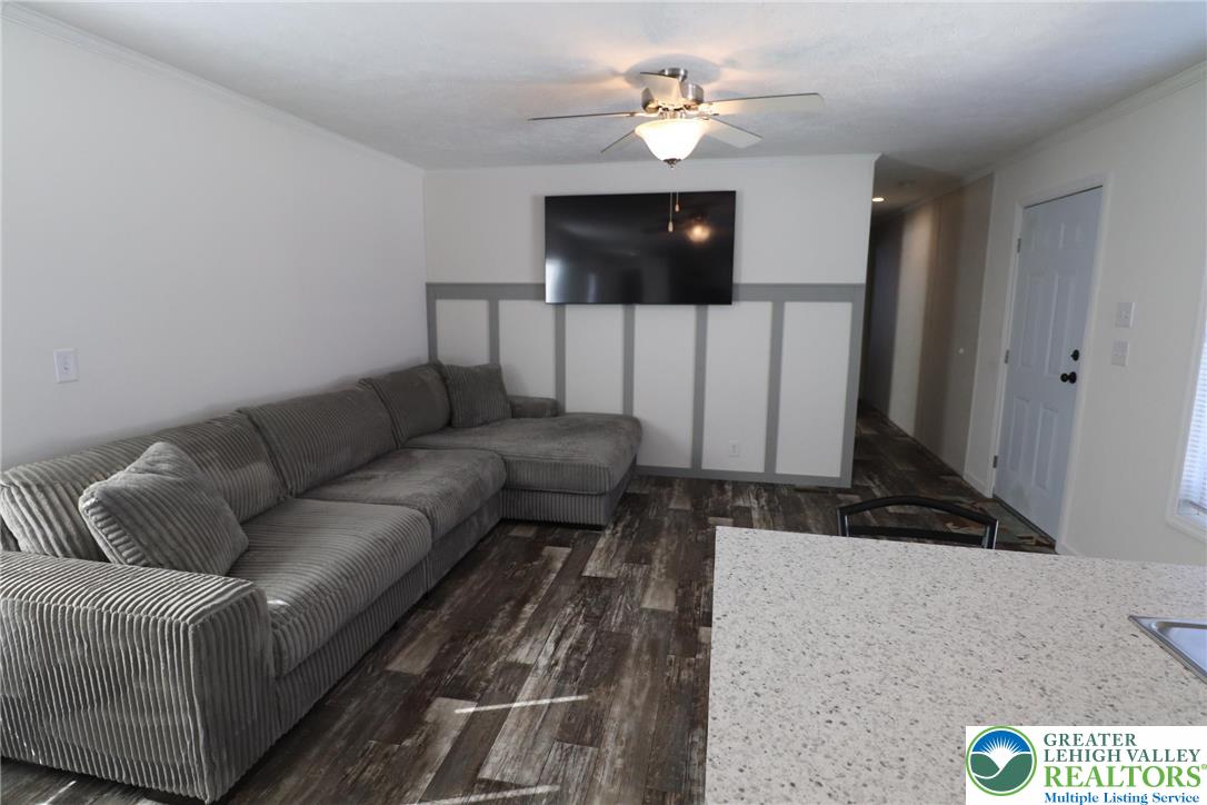 5016 Old Timber Road Stroudsburg, PA 18360 - Photo 6 of 34 a living room with furniture and a flat screen tv