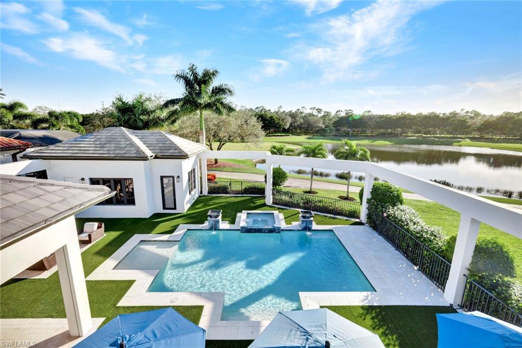 16988 Fairgrove Way Naples, FL 34110 - Photo 28 of 34 an aerial view of a house with swimming pool garden and patio