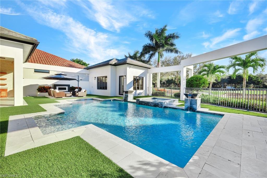 16988 Fairgrove Way Naples, FL 34110 - Photo 30 of 34 a view of a house with swimming pool