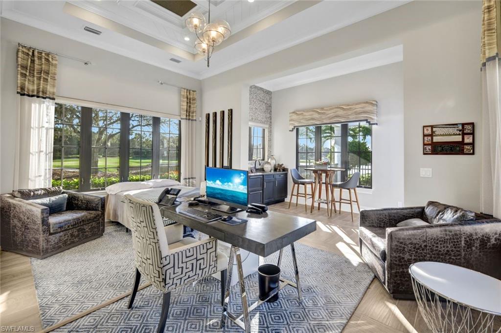 16988 Fairgrove Way Naples, FL 34110 - Photo 6 of 34 a living room with furniture and a floor to ceiling window