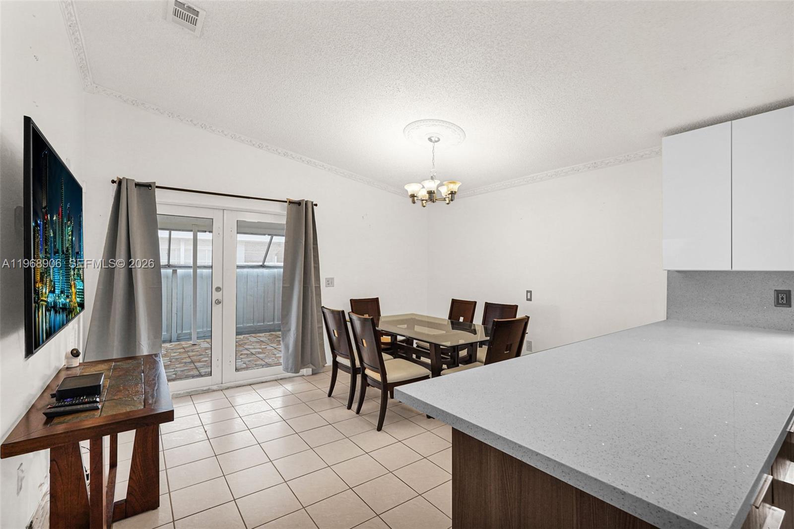 3289 West 70th Street Hialeah, FL 33018 - Photo 15 of 50 a dining room with furniture and window
