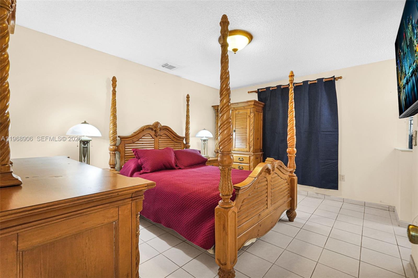 3289 West 70th Street Hialeah, FL 33018 - Photo 16 of 50 a living room with furniture and a window