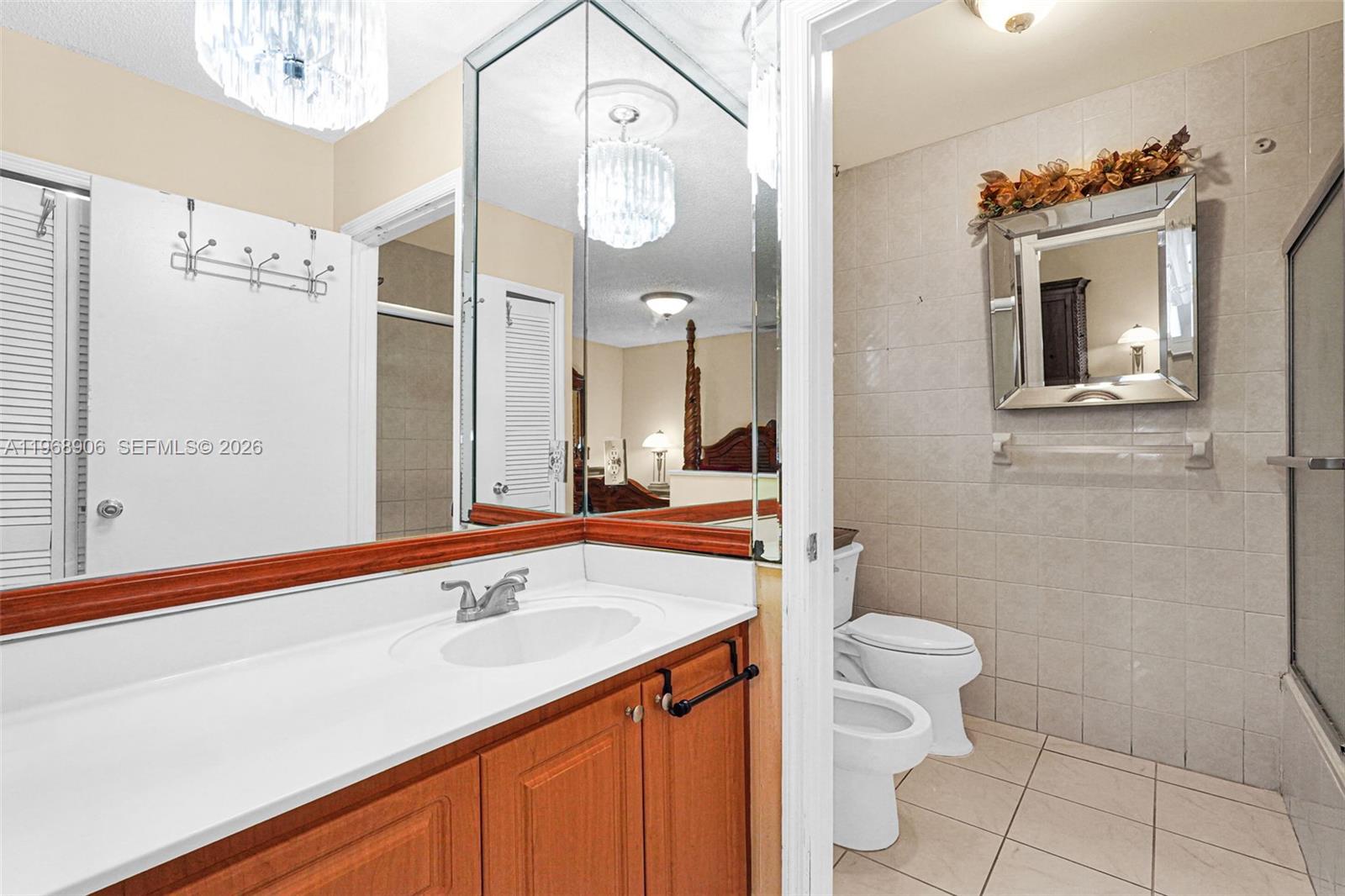 3289 West 70th Street Hialeah, FL 33018 - Photo 20 of 50 a bathroom with a sink a toilet and shower