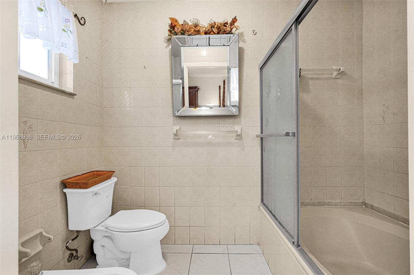 3289 West 70th Street Hialeah, FL 33018 - Photo 21 of 50 a bathroom with a toilet and a shower
