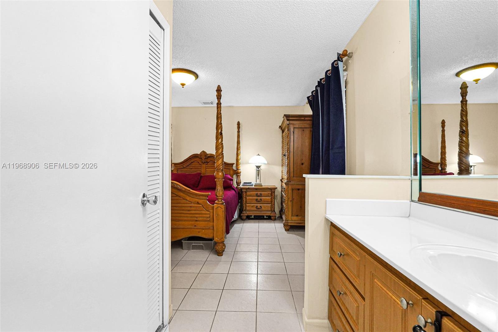 3289 West 70th Street Hialeah, FL 33018 - Photo 22 of 50 a bathroom with a sink and a mirror