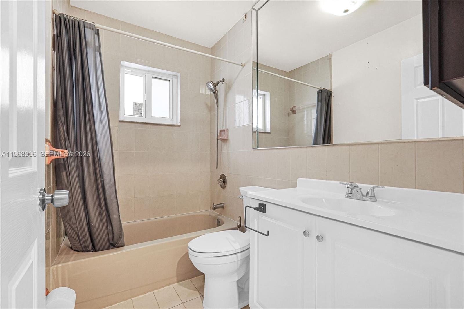 3289 West 70th Street Hialeah, FL 33018 - Photo 27 of 50 a bathroom with a sink a toilet and shower