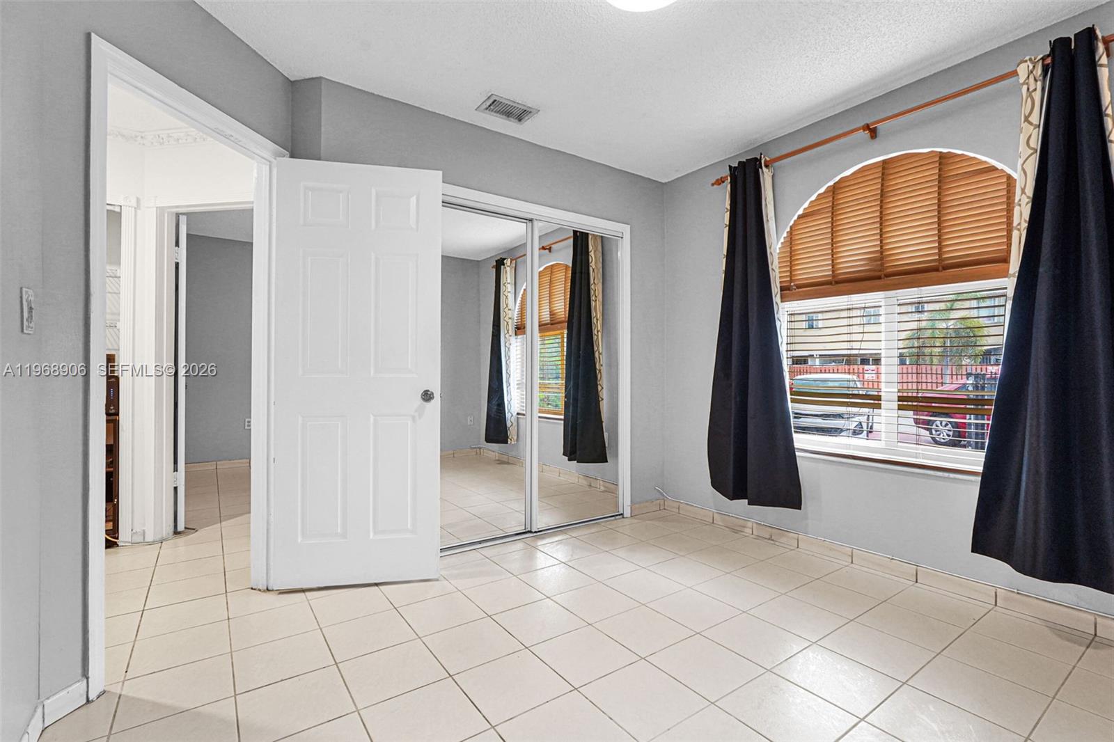 3289 West 70th Street Hialeah, FL 33018 - Photo 28 of 50 a view of an empty room with window and bathroom