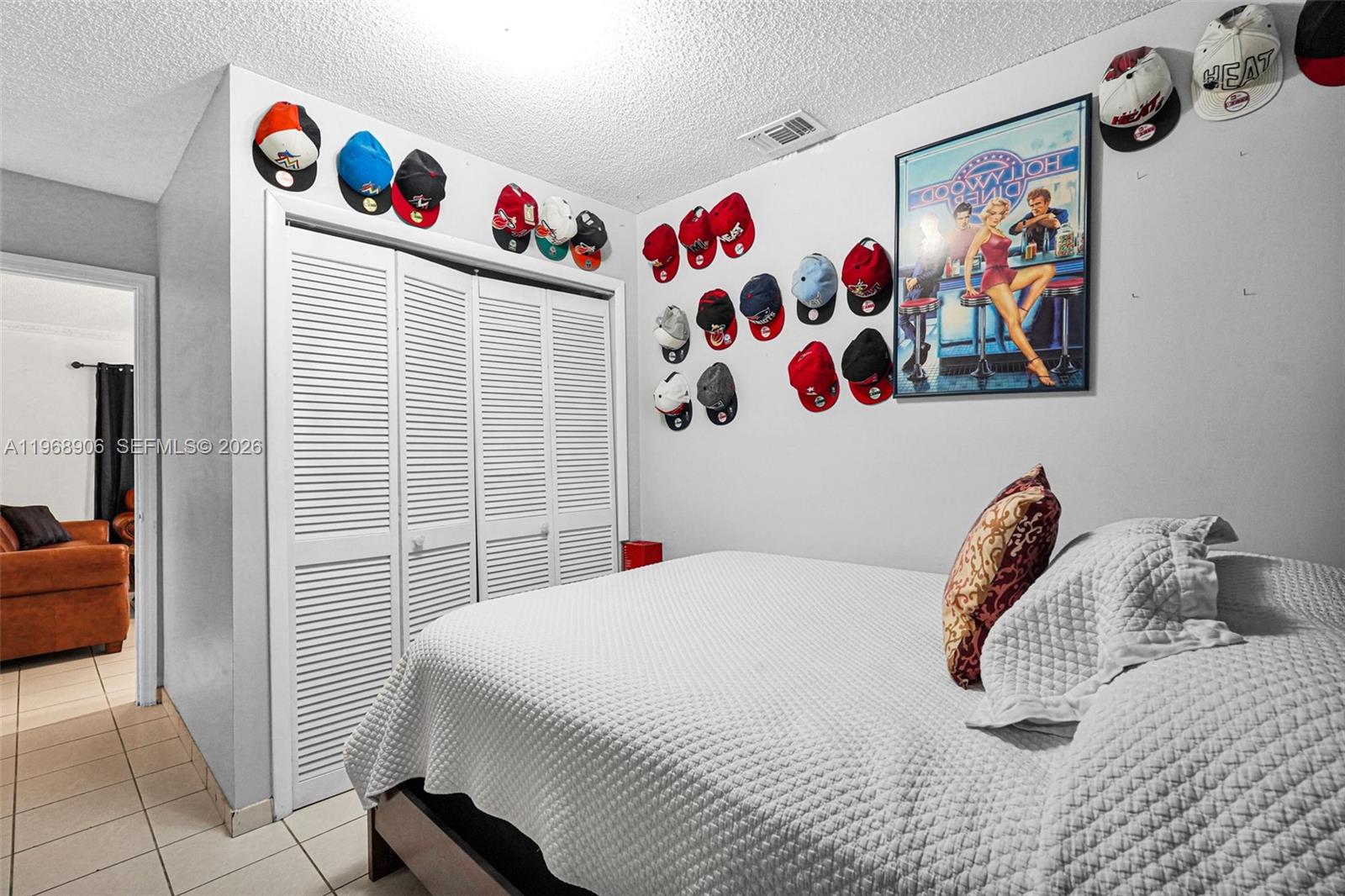 3289 West 70th Street Hialeah, FL 33018 - Photo 31 of 50 a bedroom with a bed and a couch