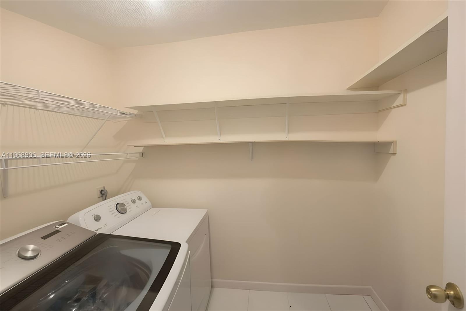 3289 West 70th Street Hialeah, FL 33018 - Photo 33 of 50 a view of storage and utility room with racks on the wall