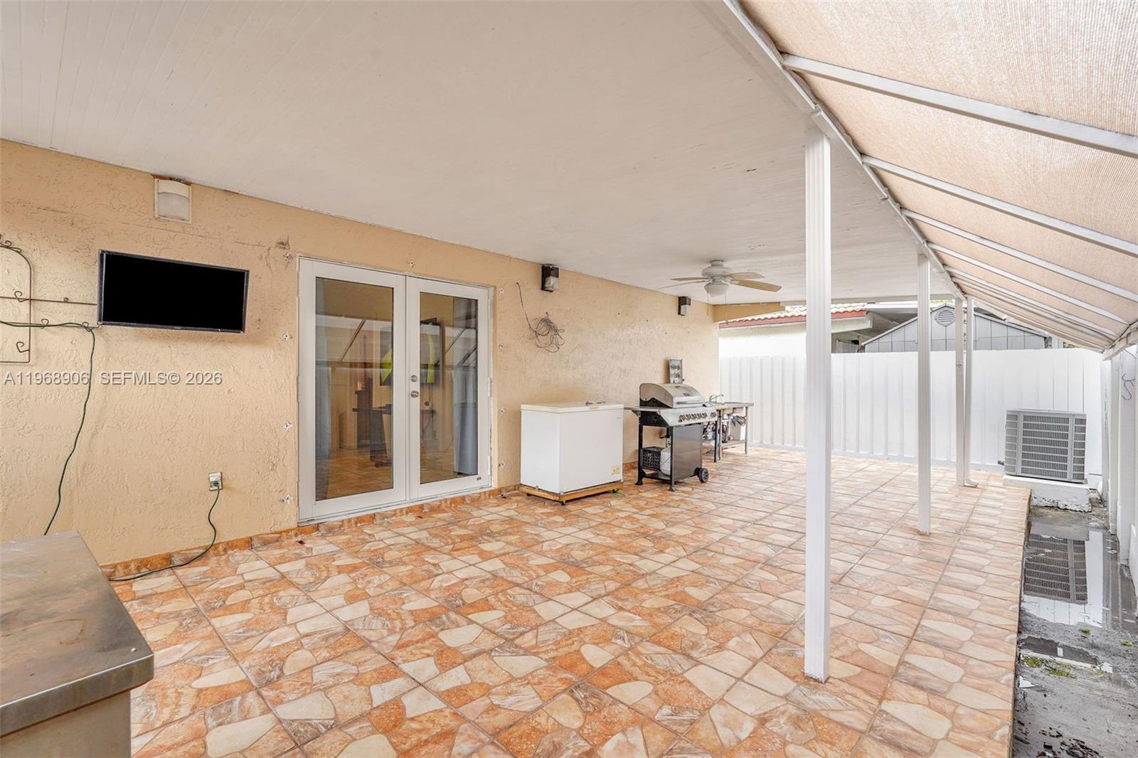 3289 West 70th Street Hialeah, FL 33018 - Photo 35 of 50 a very nice looking room with a large window and a flat screen tv
