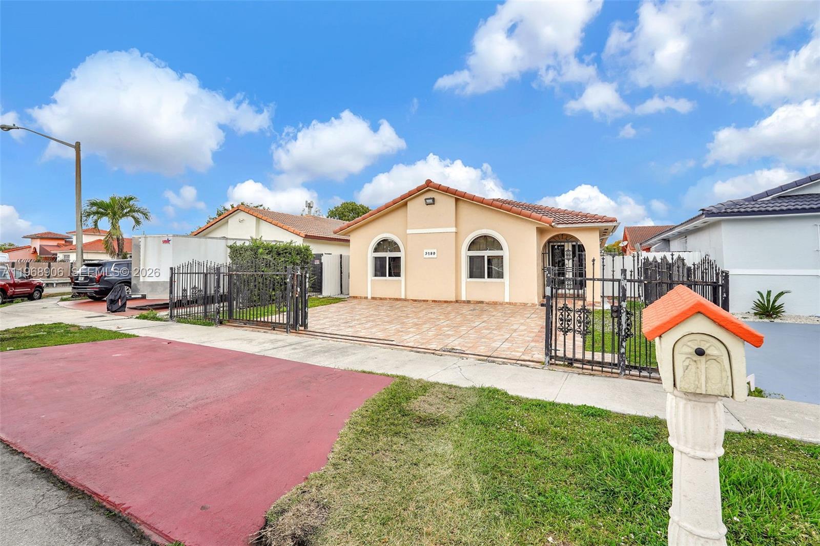3289 West 70th Street Hialeah, FL 33018 - Photo 47 of 50 a view of a house with a yard