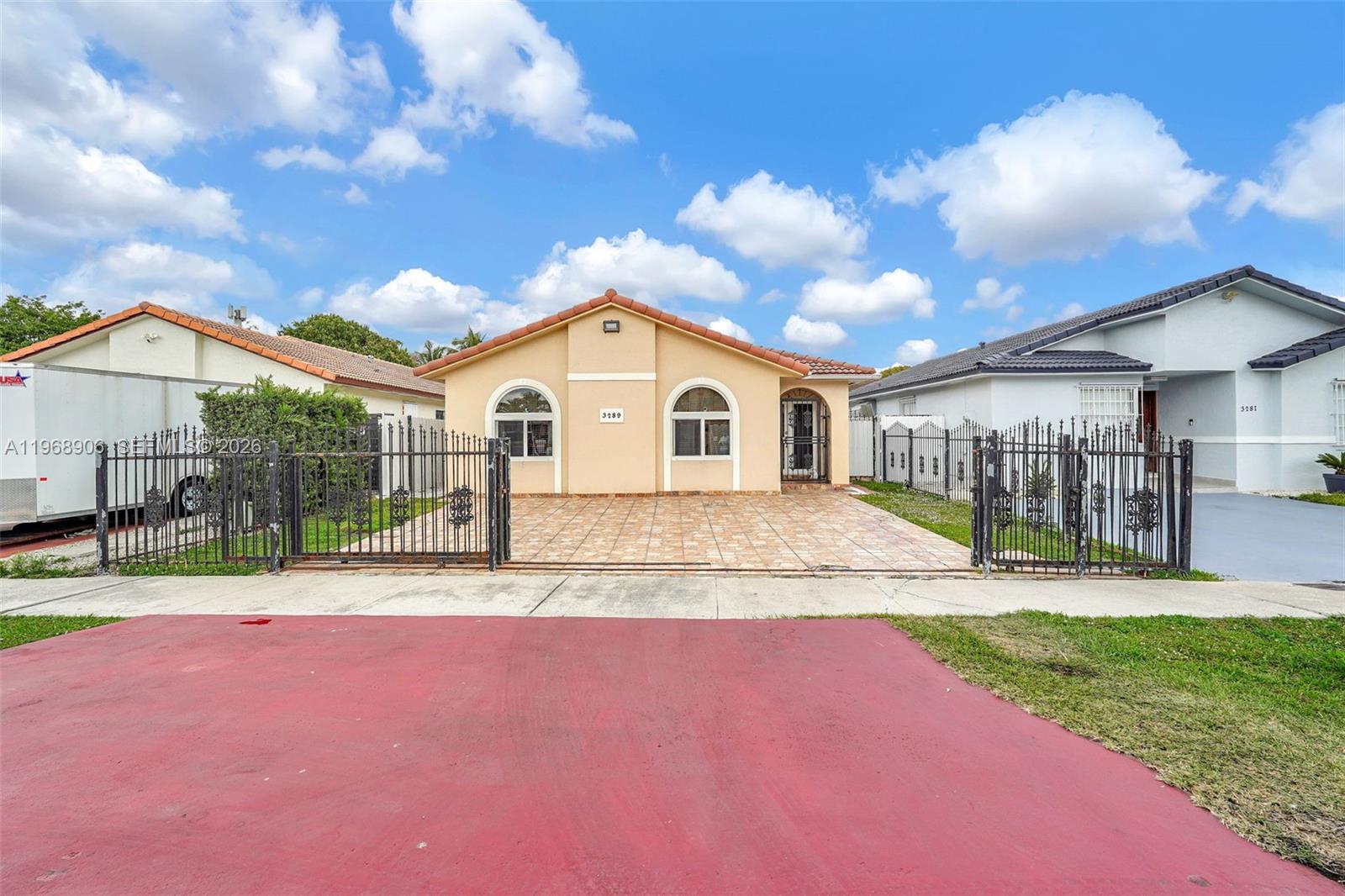 3289 West 70th Street Hialeah, FL 33018 - Photo 49 of 50 a view of an house with backyard and a tree