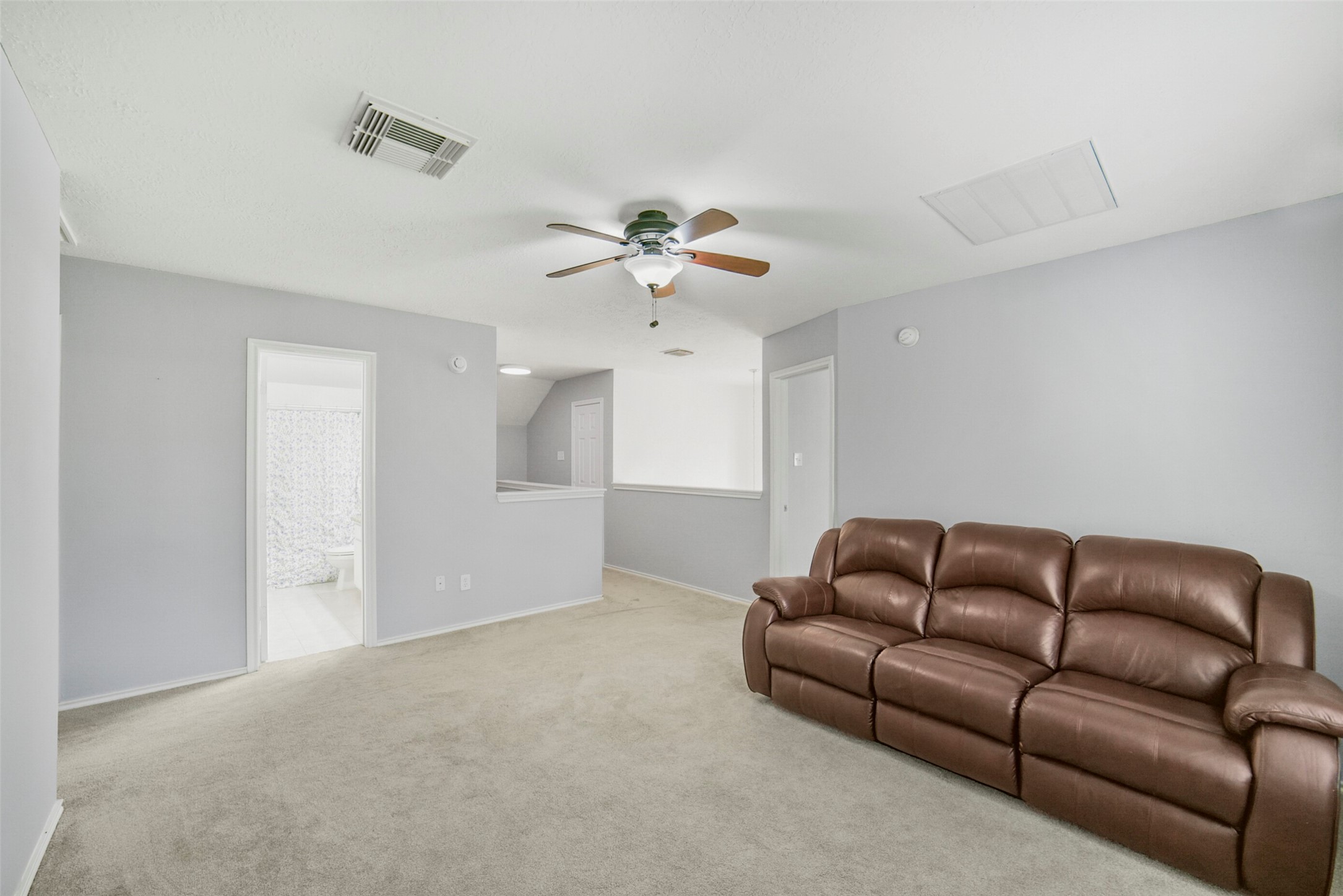 38 Tallow Hill Place Spring, TX 77382 - Photo 28 of 50 a living room with furniture a ceiling fan