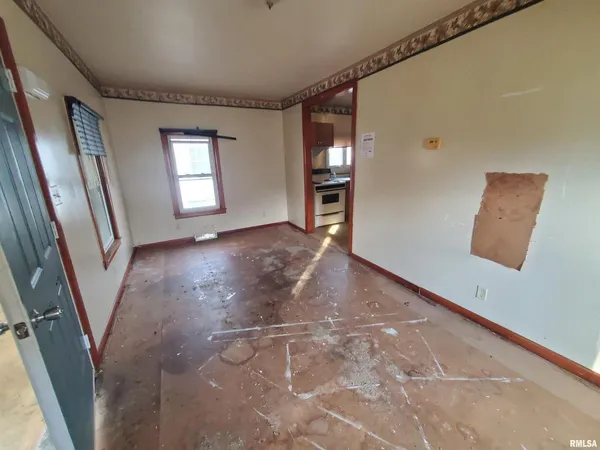 a view of an empty room with a window