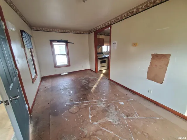 a view of an empty room with a window