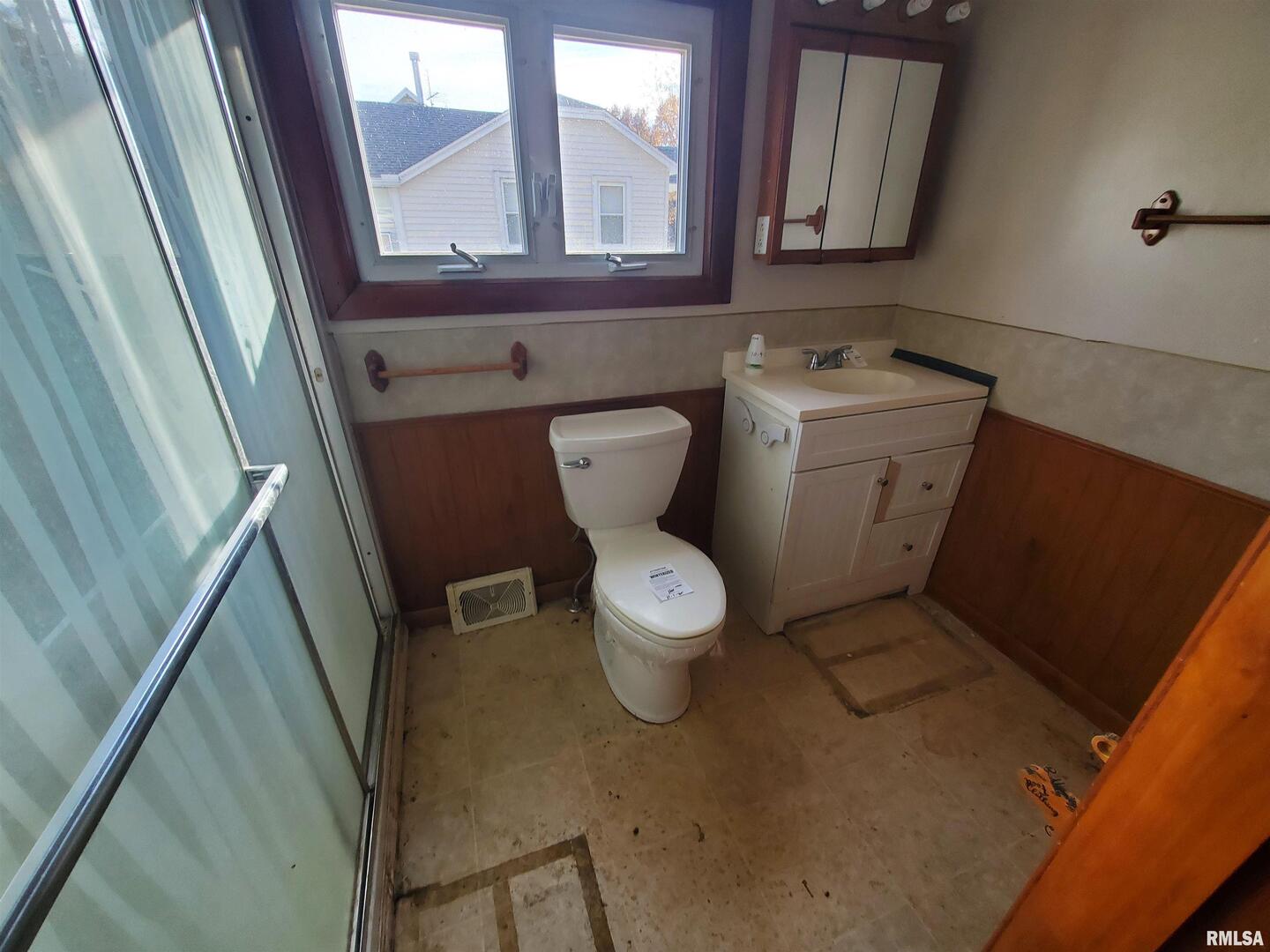 1385 Clark Street Galesburg, IL 61401 - Photo 14 of 15 a bathroom with a toilet sink and mirror