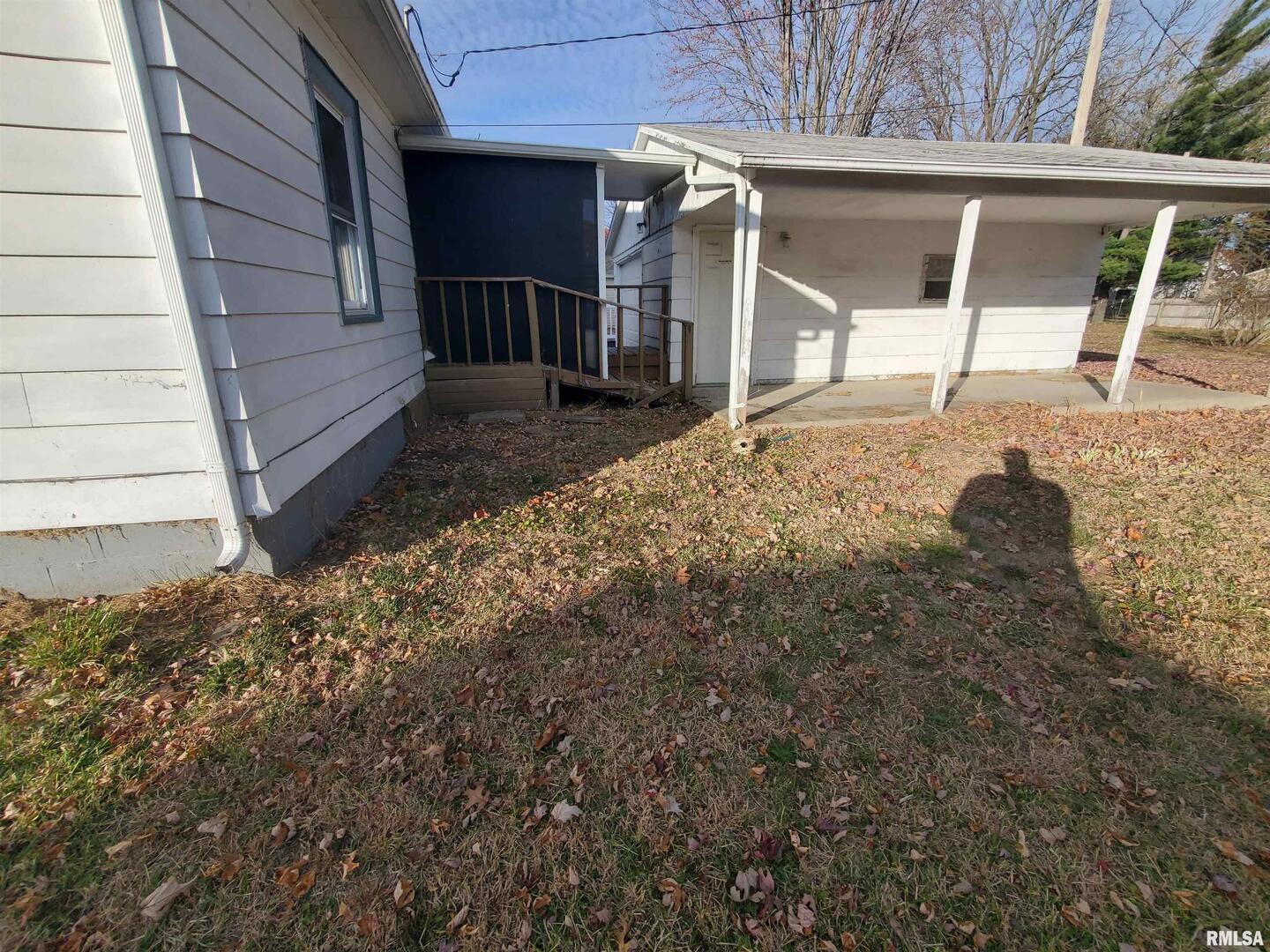 1385 Clark Street Galesburg, IL 61401 - Photo 6 of 15 a view of a house with a door and wooden walls
