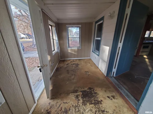 a view of an entryway with a floor to ceiling window