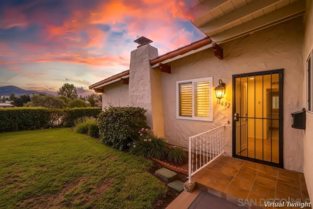 a view of backyard with seating space