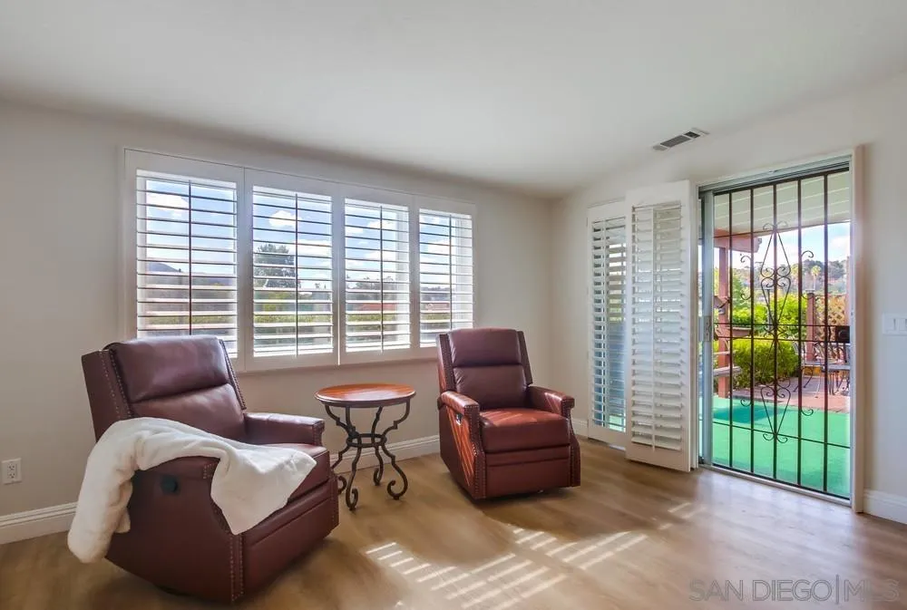 16632 Roca Drive San Diego, CA 92128 - Photo 11 of 44 a living room with furniture and a garden