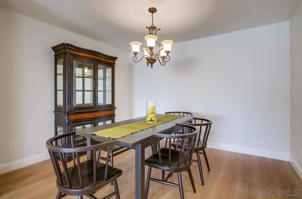 16632 Roca Drive San Diego, CA 92128 - Photo 13 of 44 a view of a dining room with furniture and chandelier