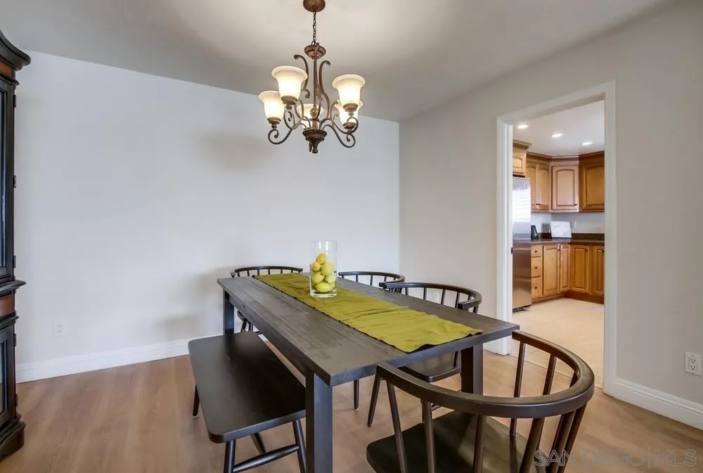 16632 Roca Drive San Diego, CA 92128 - Photo 14 of 44 a view of a dining room with furniture and wooden floor