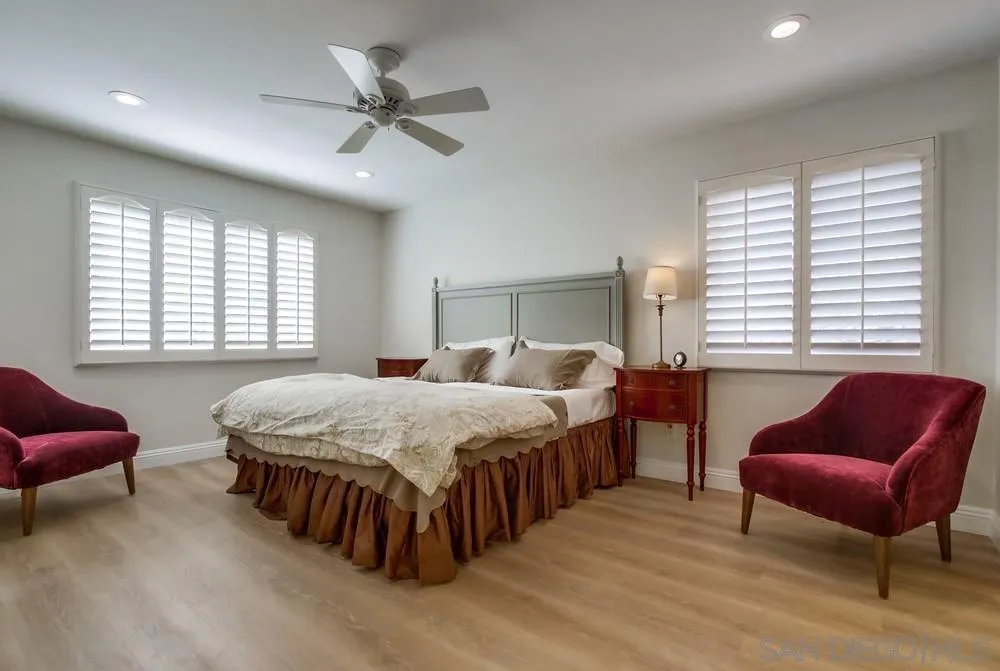 16632 Roca Drive San Diego, CA 92128 - Photo 19 of 44 a bedroom with a bed and a couch